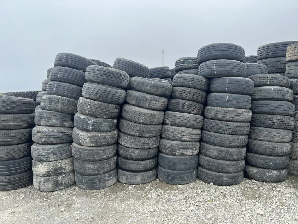 Used tires stacked at the yard in Japan before the September 2025 container loading